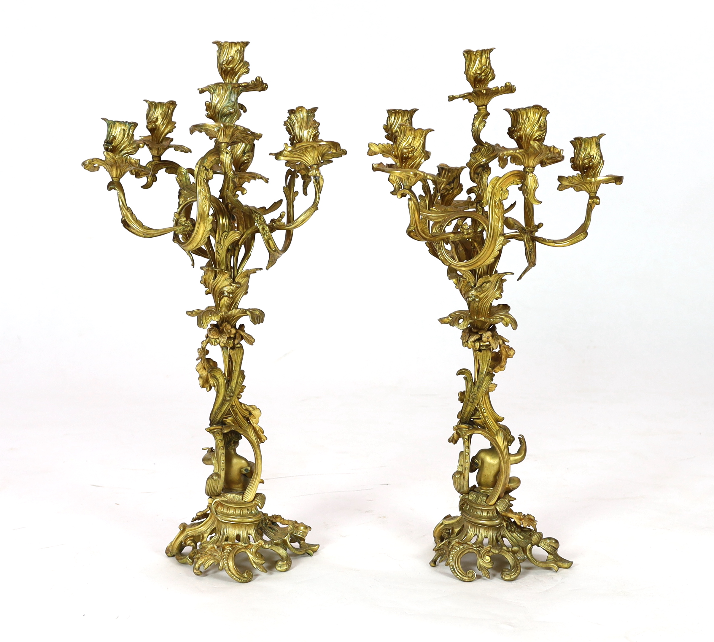 A pair of late 19th century French Louis XVI style ormolu seven light candelabra, 74cm high